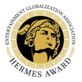 A portrait in black and gold of Hermes looking off to the right. The face forms the centre of a circular logo that is framed by intricate gold patterning around which in black lettering are the words 'Entertainment Globilization Association - Hermes Award'